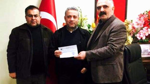 Nazilli’da esnaf kooperatifinden işyeri yanan esnafa destek
